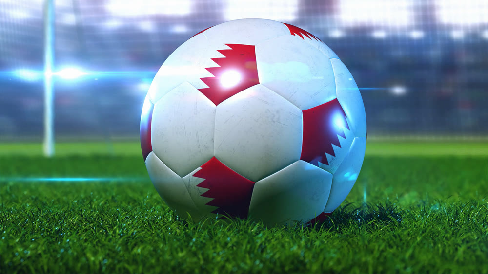 The soccer ball stands on the green lawn, but against the background of the floodlights and stands of the stadium. 3D illustration.