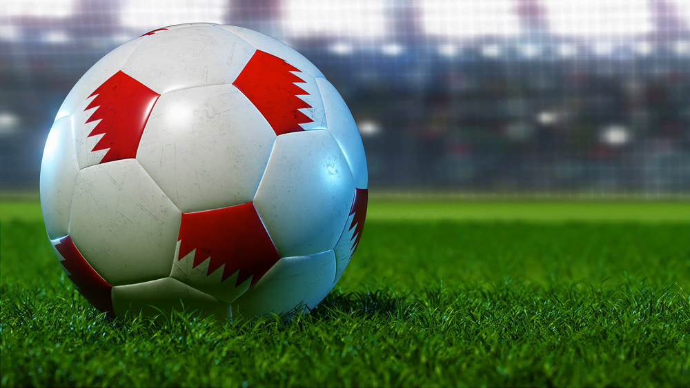 The soccer ball stands on the green lawn, but against the background of the floodlights and stands of the stadium. 3D illustration.