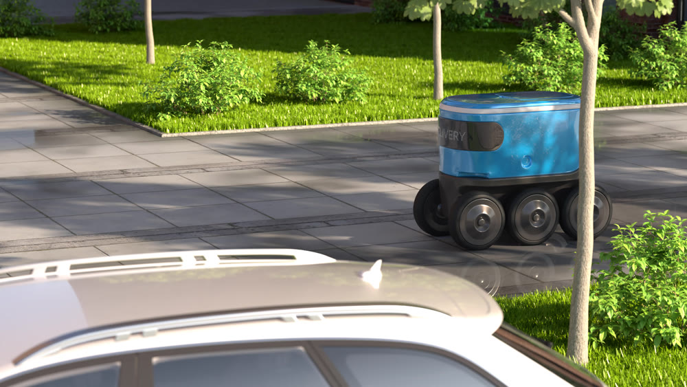 Autonomous delivery robot drives along the street